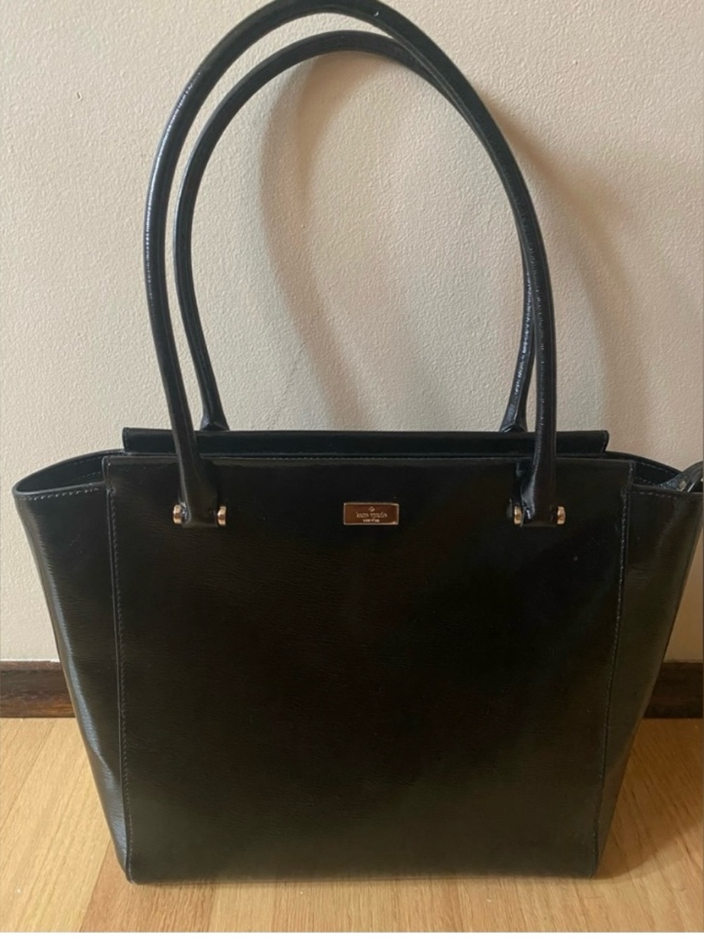 kate spade black leather satchel with gold accents